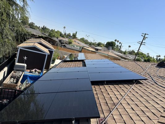 Clean black solar panels on a Bakersfield rooftop by Marz Solar